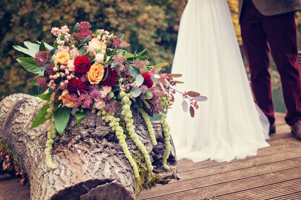 Bouquet by couple next to river | Classic Flowers | Wind in the Willows | marsala & gold | autumnal | Old Swan & Minster Mill | Witney | October 2016 | Photography by Farrow Photography www.farrowphotography.co.uk