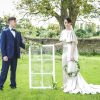 Keeping it local with suppliers for the Secret Garden shoot Bride and groom holding window table plan | The Paper Hare | The Secret Garden | modern Edwardian styled bridal shoot by Hanami Dream | greenery | perspex | Cogges Manor Farm | Witney | May 2017 | Photography by Squib Photography www.squibphotography.co.uk