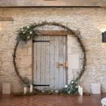 Moongate wreath circling the blue barn door | Journey to the Centre of the Earth | modern ethereal winter styled bridal shoot by Hanami Dream | agate | marble | airplants | tulle | pale blue | gold | Oxleaze Barn | Gloucestershire | October 2017 | Photography by Squib Photography www.squibphotography.co.uk