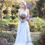 Bridesmaid looking to side in garden | Journey to the Centre of the Earth | modern ethereal winter styled bridal shoot by Hanami Dream | agate | marble | airplants | tulle | pale blue | gold | Oxleaze Barn | Gloucestershire | October 2017 | Photography by Squib Photography www.squibphotography.co.uk