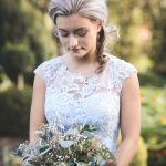 Bridesmaid looking down in garden | Journey to the Centre of the Earth | modern ethereal winter styled bridal shoot by Hanami Dream | agate | marble | airplants | tulle | pale blue | gold | Oxleaze Barn | Gloucestershire | October 2017 | Photography by Squib Photography www.squibphotography.co.uk