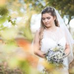Bride looking down in the garden | Journey to the Centre of the Earth | modern ethereal winter styled bridal shoot by Hanami Dream | agate | marble | airplants | tulle | pale blue | gold | Oxleaze Barn | Gloucestershire | October 2017 | Photography by Squib Photography www.squibphotography.co.uk
