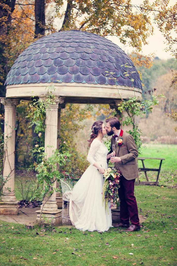 Couple under temple garden | Wind in the Willows | marsala & gold | autumnal | Old Swan & Minster Mill | Witney | October 2016 | Photography by Farrow Photography www.farrowphotography.co.uk