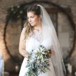 Bride looking to side in front of moongate | Journey to the Centre of the Earth | modern ethereal winter styled bridal shoot by Hanami Dream | agate | marble | airplants | tulle | pale blue | gold | Oxleaze Barn | Gloucestershire | October 2017 | Photography by Squib Photography www.squibphotography.co.uk