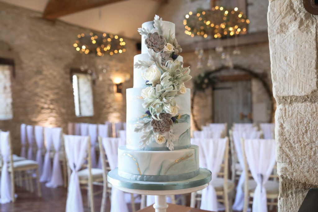 Marble cake with sugar succulent cascade | Journey to the Centre of the Earth | modern ethereal winter styled bridal shoot by Hanami Dream | agate | marble | airplants | tulle | pale blue | gold | Oxleaze Barn | Gloucestershire | October 2017 | Photography by Squib Photography www.squibphotography.co.uk