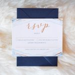 RSVP card on sheep skin rug | Journey to the Centre of the Earth | modern ethereal winter styled bridal shoot by Hanami Dream | agate | marble | airplants | tulle | pale blue | gold | Oxleaze Barn | Gloucestershire | October 2017 | Photography by Squib Photography www.squibphotography.co.uk
