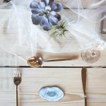 Delicate place setting with gold cutlery | Journey to the Centre of the Earth | modern ethereal winter styled bridal shoot by Hanami Dream | agate | marble | airplants | tulle | pale blue | gold | Oxleaze Barn | Gloucestershire | October 2017 | Photography by Squib Photography www.squibphotography.co.uk