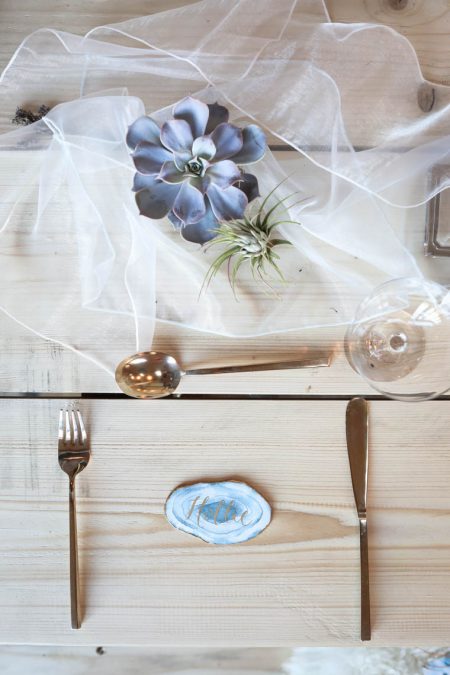 Delicate place setting with gold cutlery | Journey to the Centre of the Earth | modern ethereal winter styled bridal shoot by Hanami Dream | agate | marble | airplants | tulle | pale blue | gold | Oxleaze Barn | Gloucestershire | October 2017 | Photography by Squib Photography www.squibphotography.co.uk