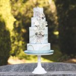 Close up of cake in the maze | Journey to the Centre of the Earth | modern ethereal winter styled bridal shoot by Hanami Dream | agate | marble | airplants | tulle | pale blue | gold | Oxleaze Barn | Gloucestershire | October 2017 | Photography by Squib Photography www.squibphotography.co.uk