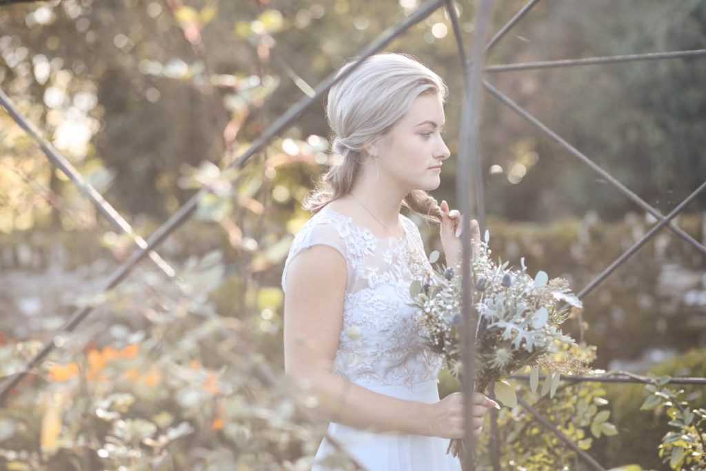 Bridesmaid deep in thought | Journey to the Centre of the Earth | modern ethereal winter styled bridal shoot by Hanami Dream | agate | marble | airplants | tulle | pale blue | gold | Oxleaze Barn | Gloucestershire | October 2017 | Photography by Squib Photography www.squibphotography.co.uk